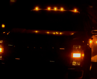 Utility truck with beacons at night